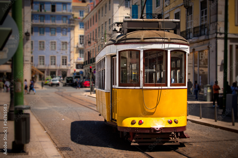 Old isbon yellow tram on the street
