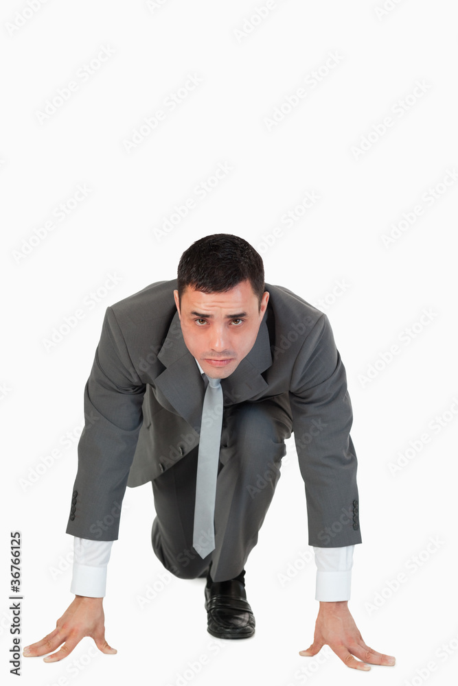 Portrait of a businessman in the starting blocs Portrait of a businessman in the starting blocs