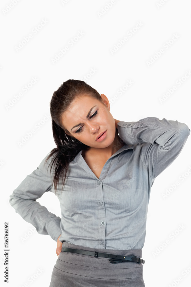 Portrait of a gorgeous businesswoman having back pain Portrait of a gorgeous businesswoman having back pain