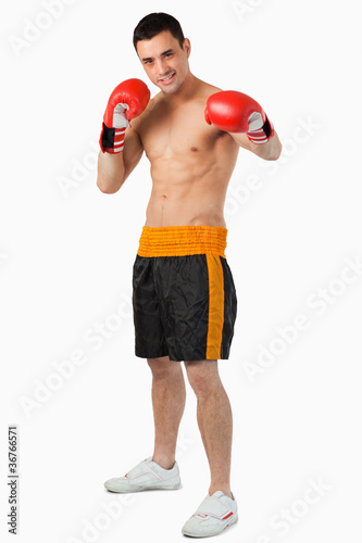 Young boxer performing a left hook © WavebreakmediaMicro
