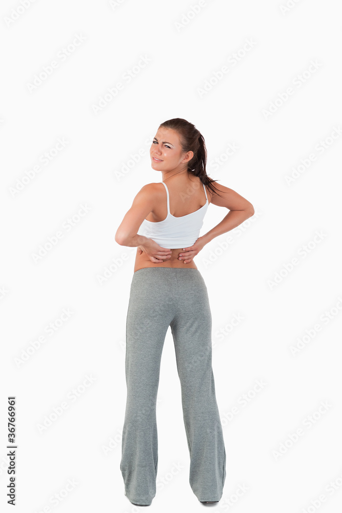 Back view of woman with back pain Back view of woman with back pain