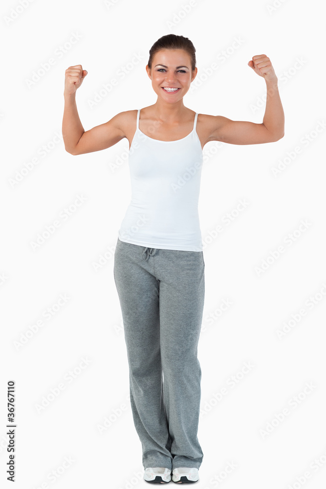Young female showing her muscles Young female showing her muscles