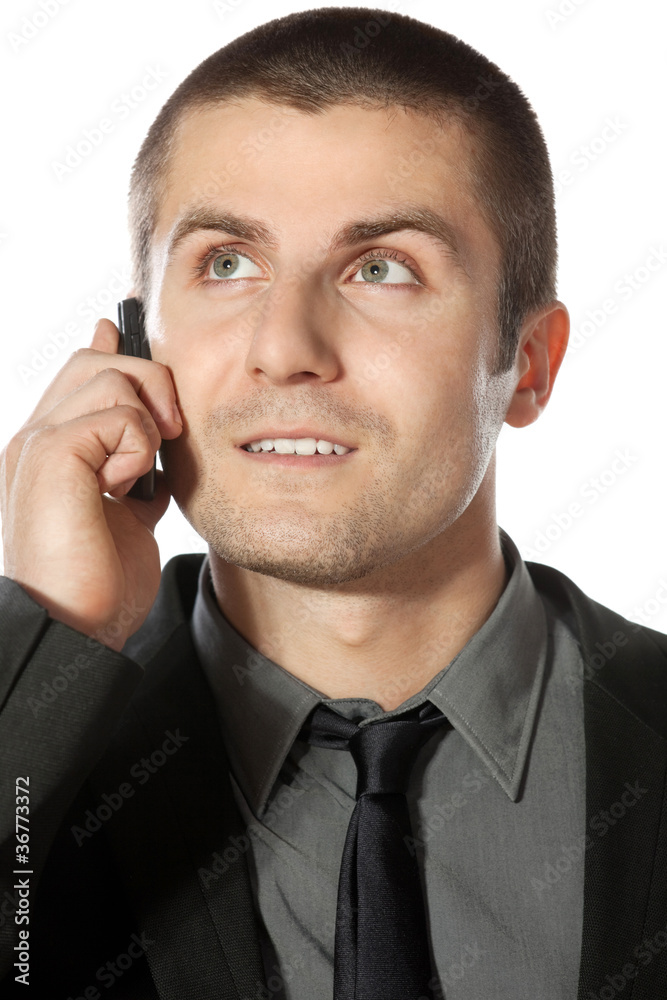 Close up portrait of young businessman talking on phone Close up portrait of young businessman talking on phone