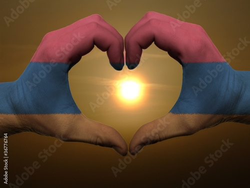 Heart and love gesture by hands colored in armenia flag during b