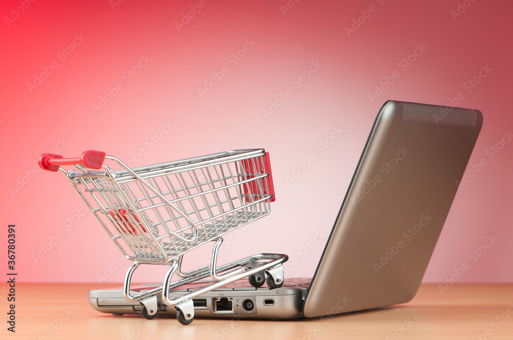 Internet online shopping concept with computer and cart Internet online shopping concept with computer and cart