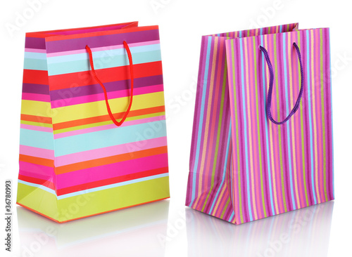 bright gift bags isolated on white