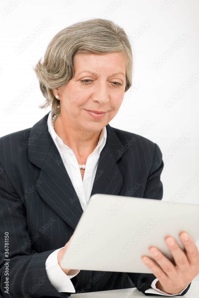 Senior businesswoman touch-screen tablet computer Senior businesswoman touch-screen tablet computer