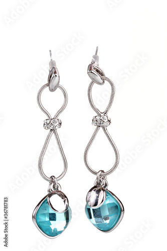 beautiful silver earrings with precious stones isolated on white