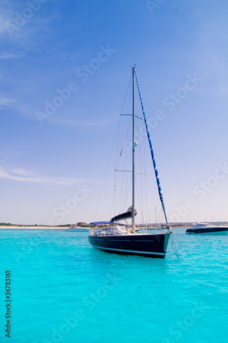 sailboat in turquoise beach of Formentera