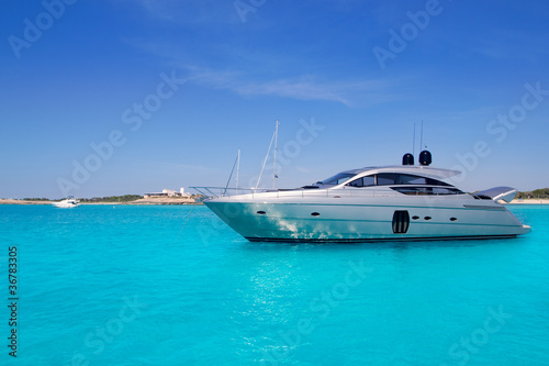 yatch in turquoise beach of Formentera photo