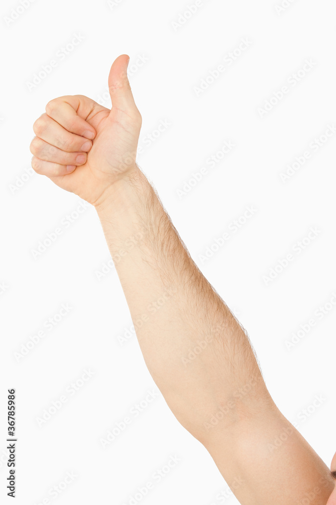 Side view of male arm giving thumb up Side view of male arm giving thumb up
