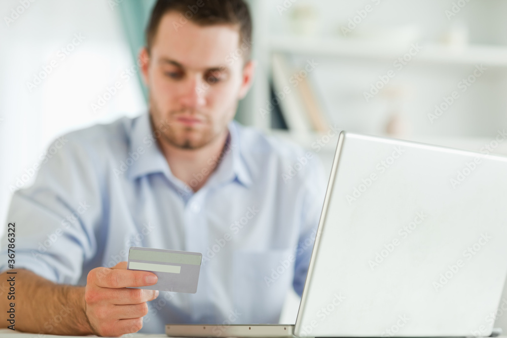 Businessman with credit card and notebook Businessman with credit card and notebook