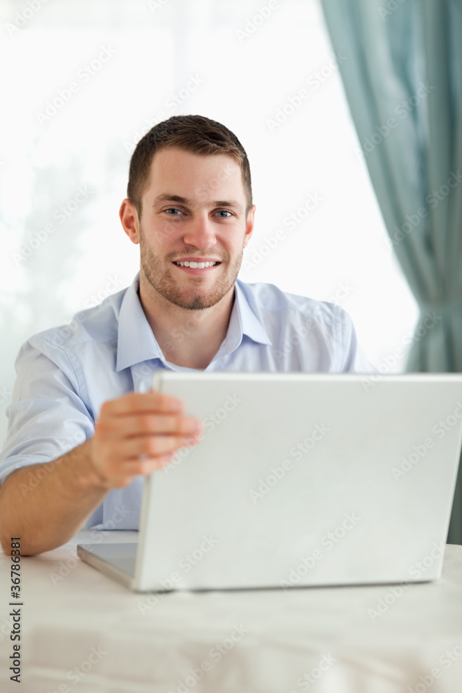 Businessman on his laptop behind a desk