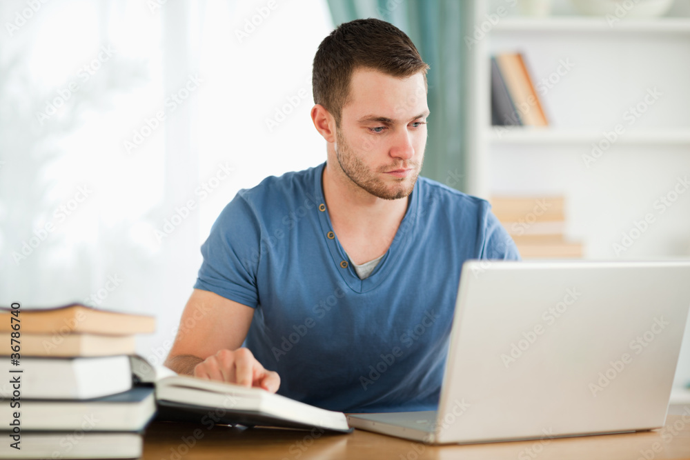Student researching material on the internet Student researching material on the internet