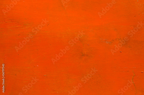 Wooden plank orange color paint background.