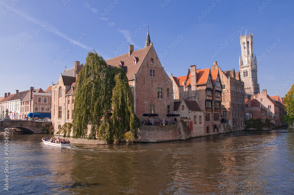 Belgium - Brugge - View of old houses and canal with boat