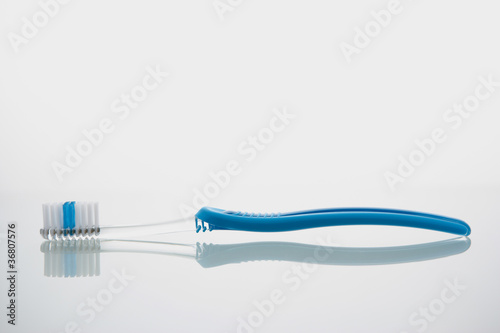 Toothbrush lying on glass shelf