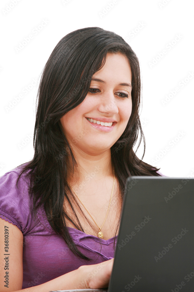 Portrait of a beautiful young woman working on laptop Portrait of a beautiful young woman working on laptop