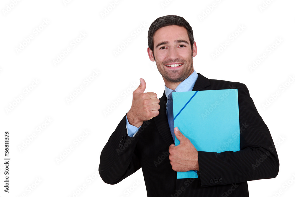 Businessman holding a folder and giving the thumb's up
