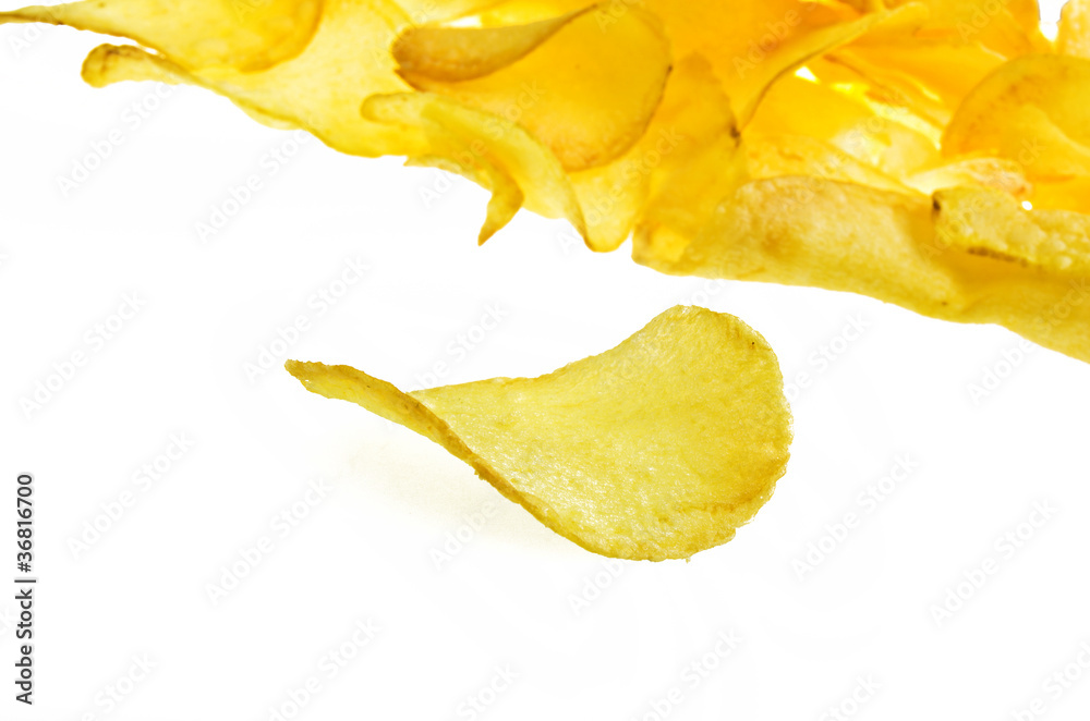 Naklejka premium potato chips on the white background