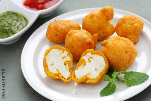 cauliflower pakora , indian fritter cuisine photo