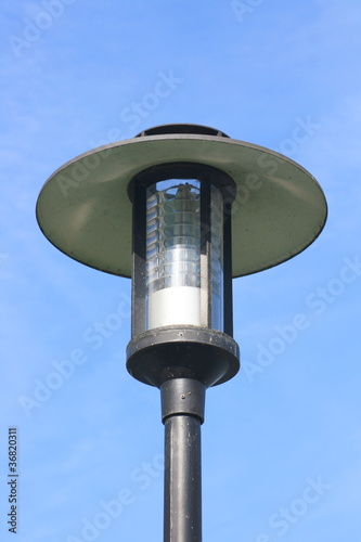 Street lamp with a large screen, blue sky in the background