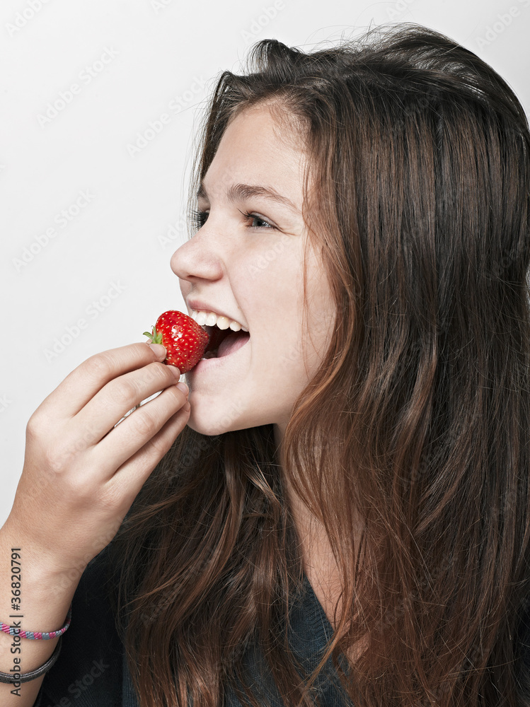 Young beautiful happy smiling woman with strawberry Young beautiful happy smiling woman with strawberry