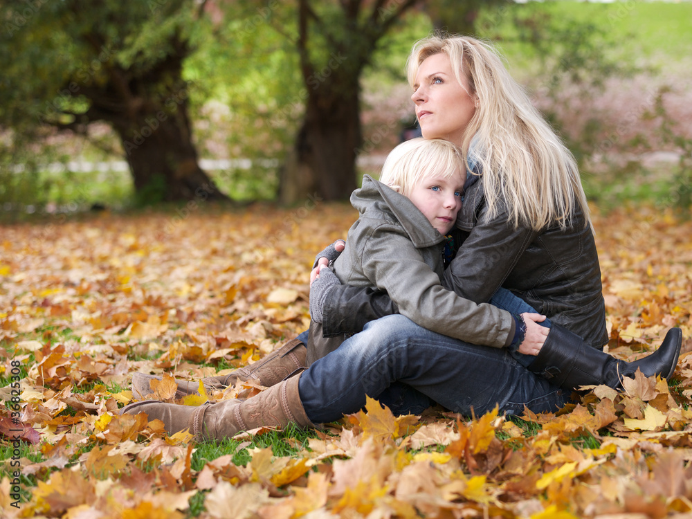 Blonde mother and daughter enjoy the autumn time outside Blonde mother and daughter enjoy the autumn time outside