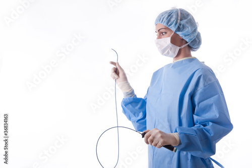Female doctor or nurse holding a catheter