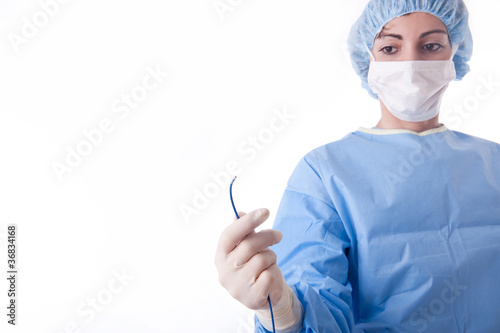 Female doctor or nurse holding a catheter