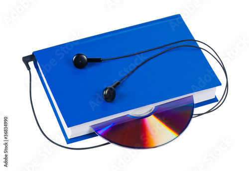 Book with headphones and cd isolated on white background.