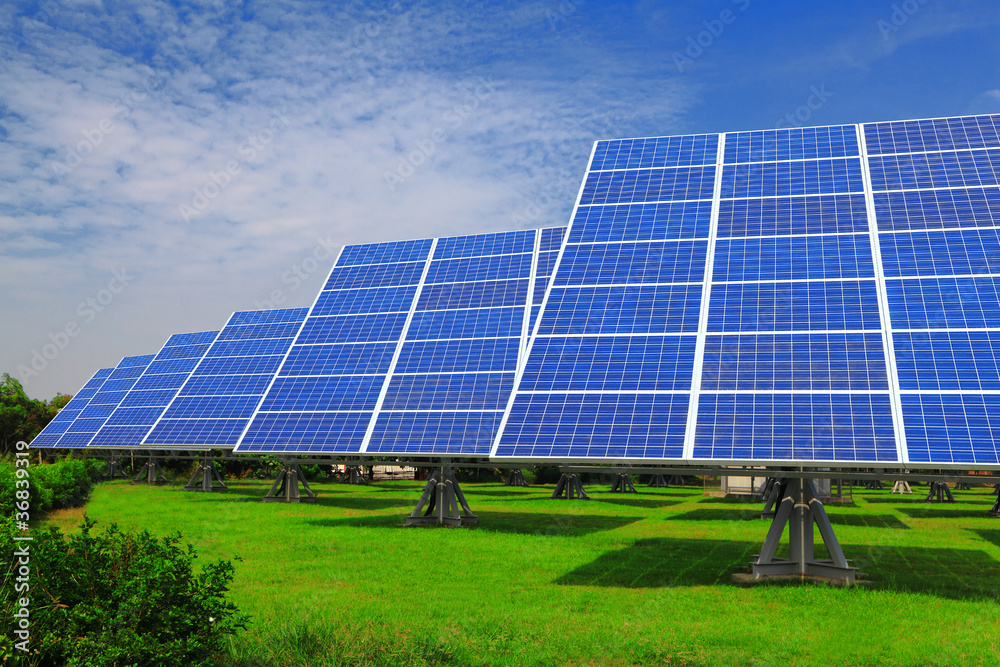Solar Panel with green grass and beautiful blue sky Solar Panel with green grass and beautiful blue sky