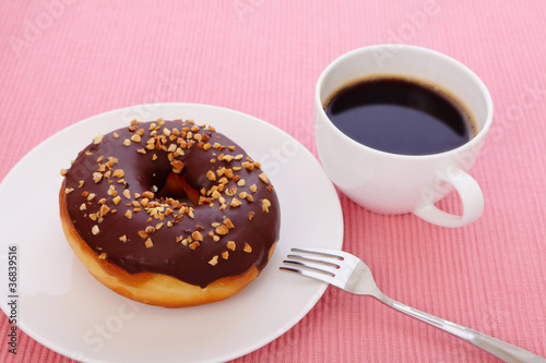 sweet chocolate donut with a cup of coffee