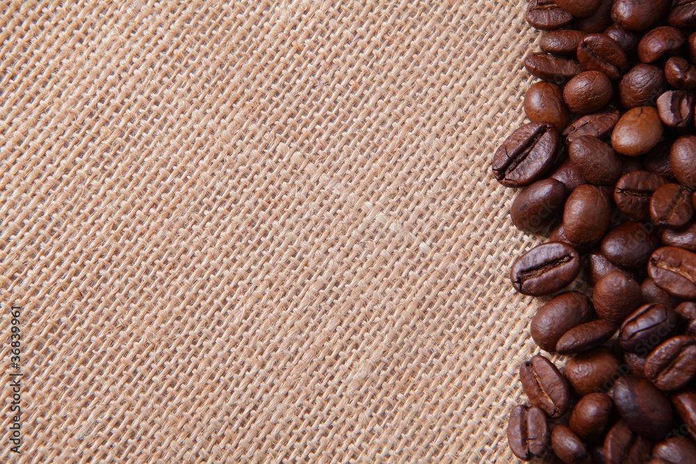 Coffee beans on linen background
