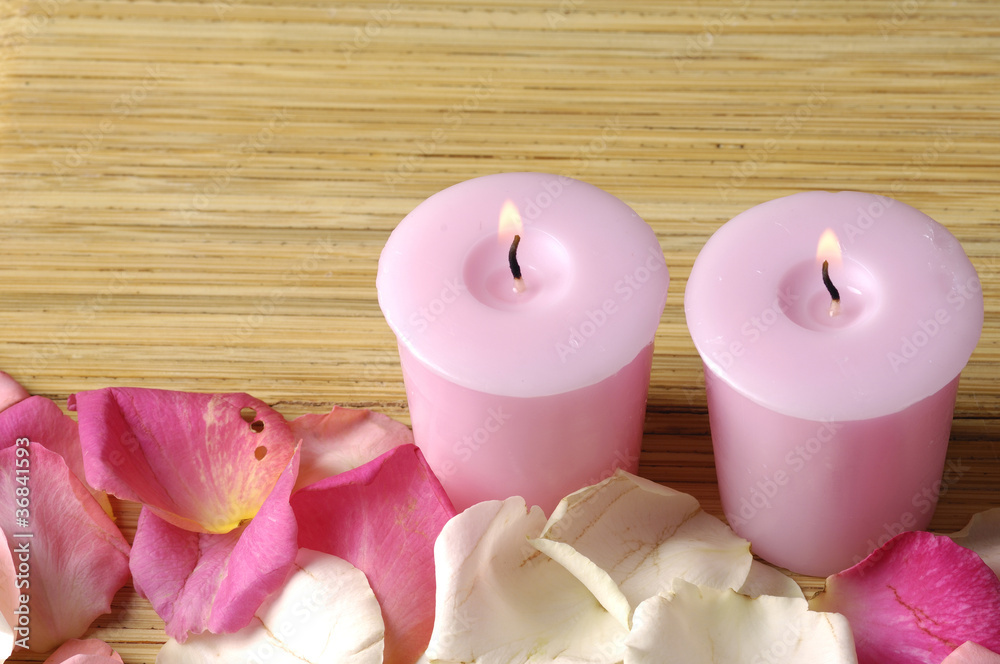 Romantic still-life with pink candle and rose petals Romantic still-life with pink candle and rose petals