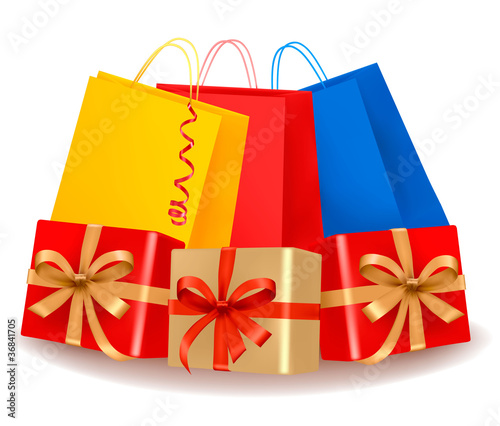 Set of colorful gift boxes with red and gold ribbons.