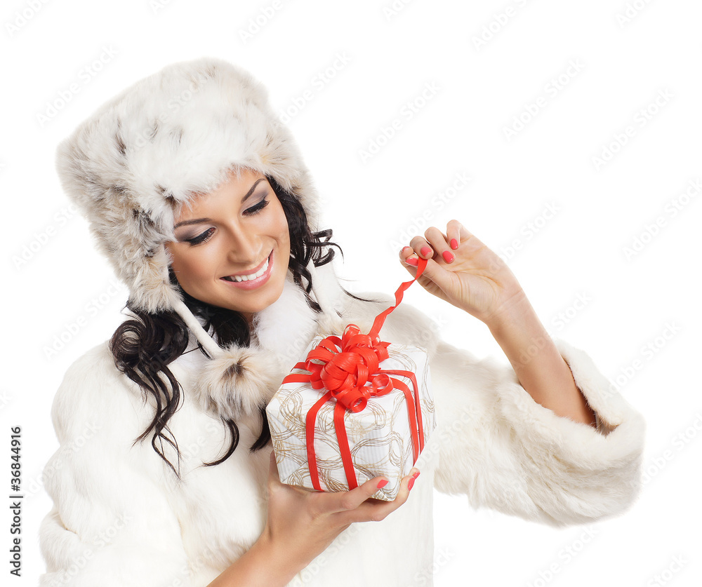 Young and beautiful woman holding a Christmas present Young and beautiful woman holding a Christmas present