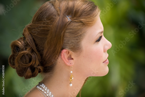 Beautiful young woman in profile