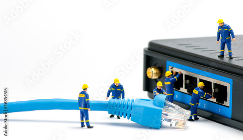 Technicians connecting network cable