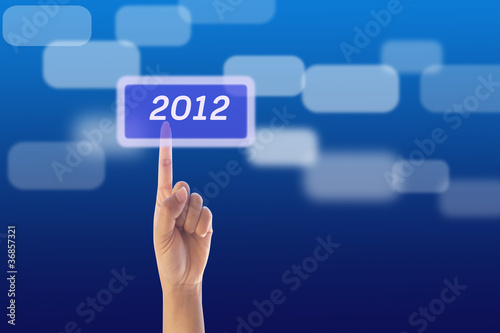 hand pressing 2012 button