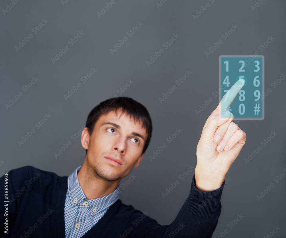 Portrait of adult business man pressing a touchscreen button whi Portrait of adult business man pressing a touchscreen button whi