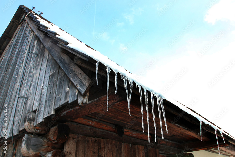 Slovak wooden roof with ice candles