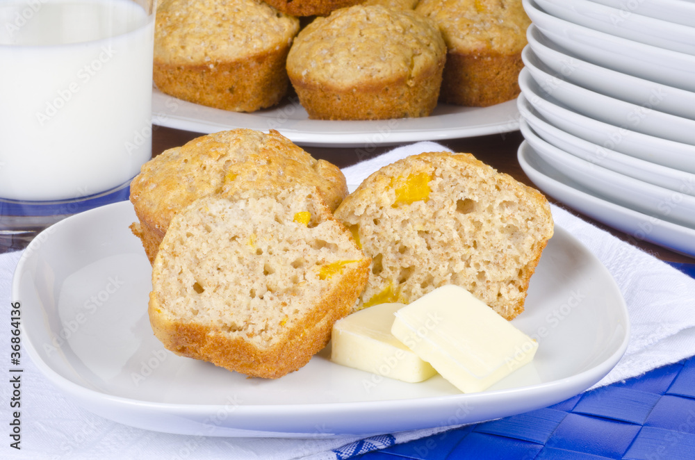 Homemade Peach Muffins Served with Butter and Milk Homemade Peach Muffins Served with Butter and Milk