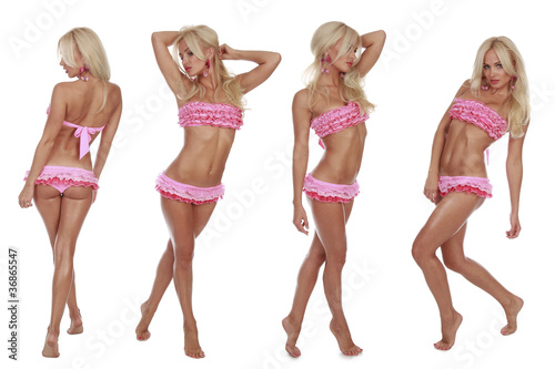 Beautiful model in pink bikini posing on a white background