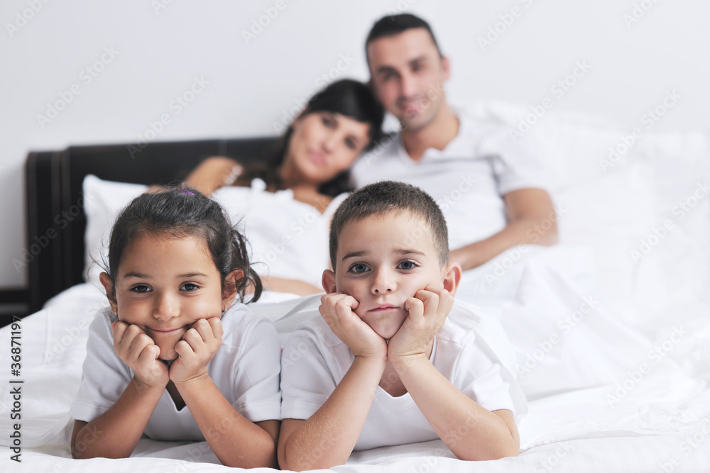 happy young Family in their bedroom happy young Family in their bedroom