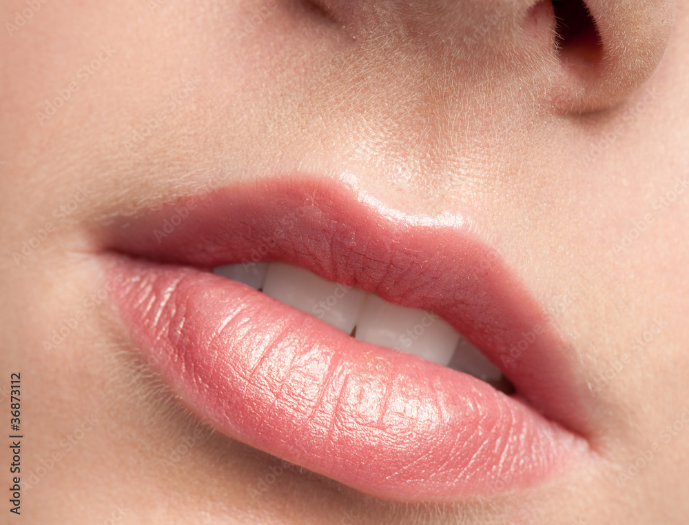 Fototapeta premium Close-up lips of beauty young woman