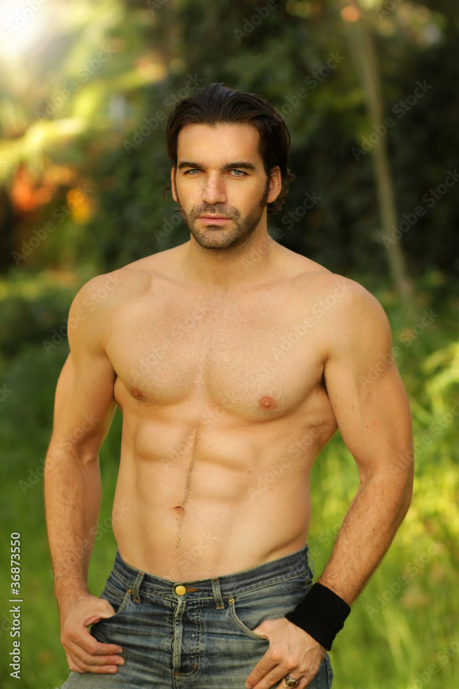 Outdoor portrait of a shirtless good looking fit male model Outdoor portrait of a shirtless good looking fit male model