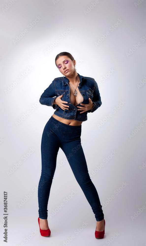 sexy girl posing in jeans dress - take breast Stock Photo | Adobe Stock