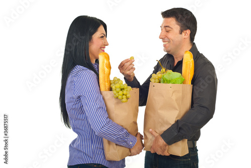 Laughing couple having coversation at shopping photo