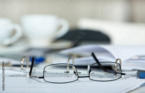 Eyeglasses and papers